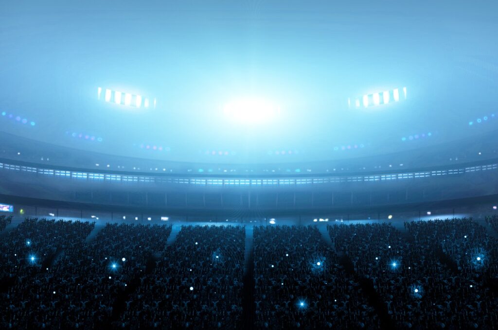 Die Fans auf den Tribünen bei Nacht. Ein imaginäres Stadion wird modelliert und gerendert.